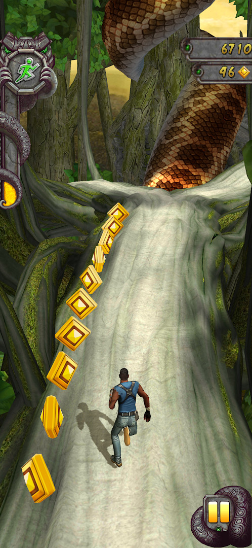 Character sliding under a low barrier in a lush jungle setting